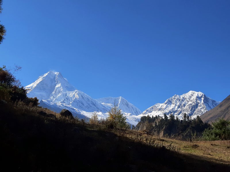 From left to right: Manaslu (8163m), Manaslu North (6991m), and Naike Peak (6221) as seen from Lho Village